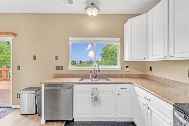 19463 E Hollow Creek Dr, Parker, CO 80134 - kitchen featuring appliances with stainless steel finishes, white cabinetry, light countertops, and wood finished floors