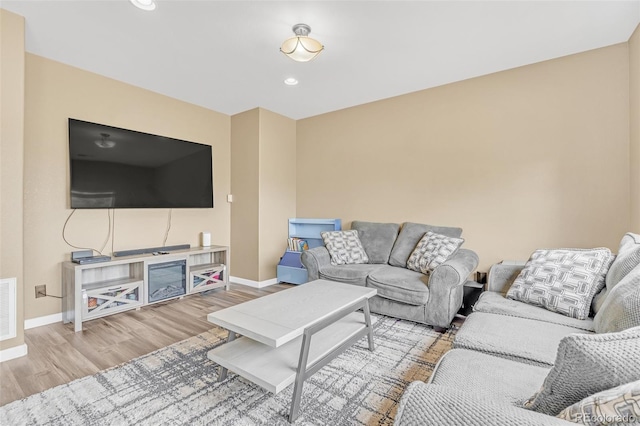19463 E Hollow Creek Dr, Parker, CO 80134 - living area with wood finished floors and recessed lighting