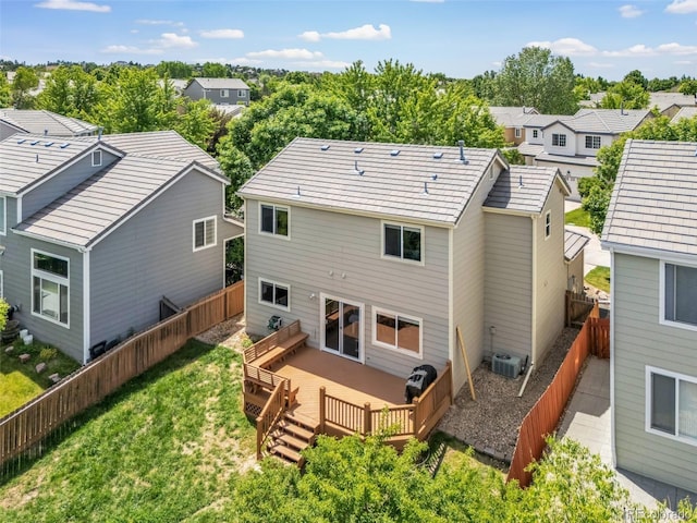 19463 E Hollow Creek Dr, Parker, CO 80134 - rear view of house featuring a residential view, a deck, and a fenced backyard