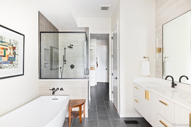 766 Dreamcatcher Ln, Evergreen, CO 80439 - full bath with tile patterned flooring, a freestanding tub, a stall shower, and vanity