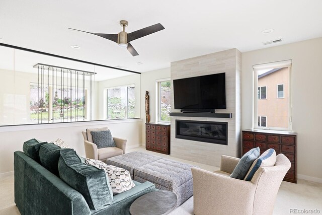 766 Dreamcatcher Ln, Evergreen, CO 80439 - living room featuring ceiling fan, light colored carpet, a tiled fireplace, and recessed lighting