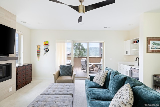 766 Dreamcatcher Ln, Evergreen, CO 80439 - living area featuring light carpet and ceiling fan