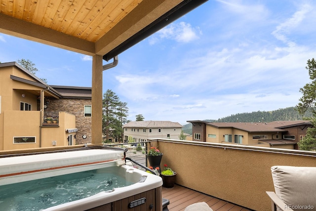 766 Dreamcatcher Ln, Evergreen, CO 80439 - balcony featuring a hot tub and a residential view