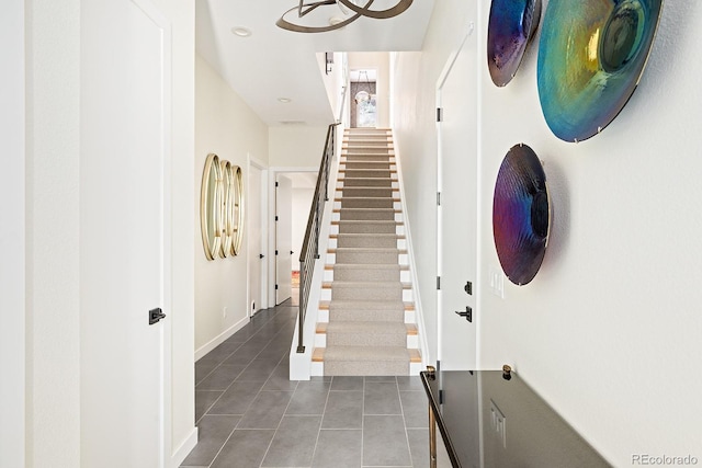 766 Dreamcatcher Ln, Evergreen, CO 80439 - staircase featuring tile patterned floors and recessed lighting
