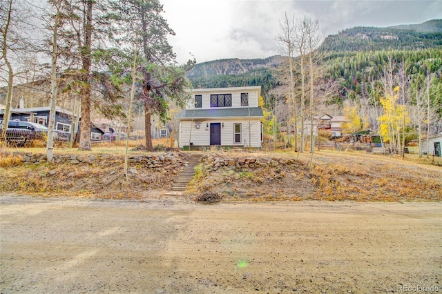 view of front of home featuring a mountain view