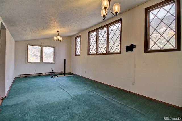 spare room featuring lofted ceiling, a textured ceiling, carpet flooring, and a healthy amount of sunlight