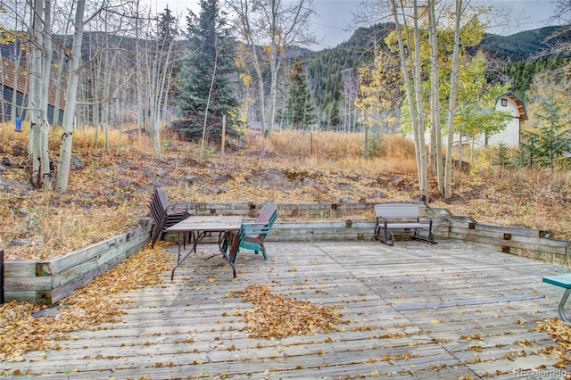 wooden terrace featuring a mountain view