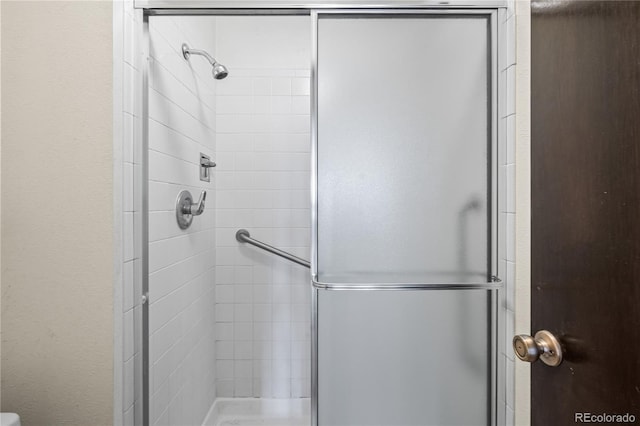 bathroom with a stall shower
