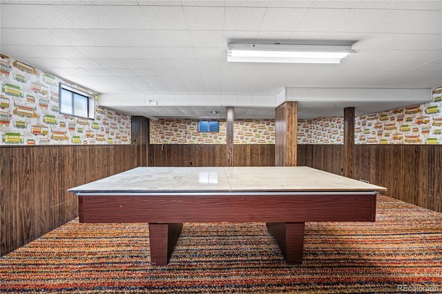 game room featuring pool table, wooden walls, and a wainscoted wall