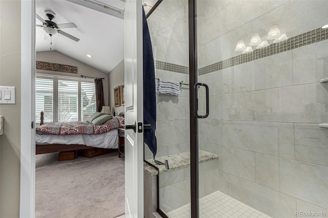 bathroom featuring ceiling fan, an enclosed shower, and lofted ceiling