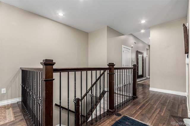 corridor featuring dark hardwood / wood-style floors