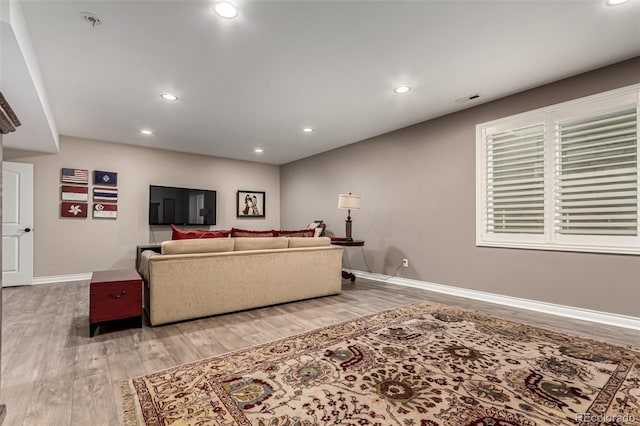 living room with light hardwood / wood-style floors