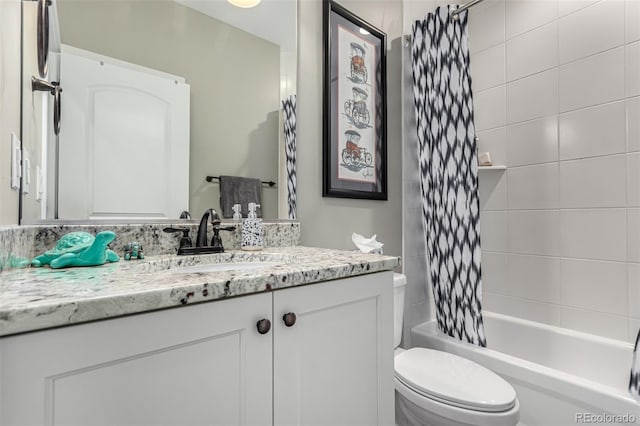 full bathroom with shower / tub combo, vanity, and toilet