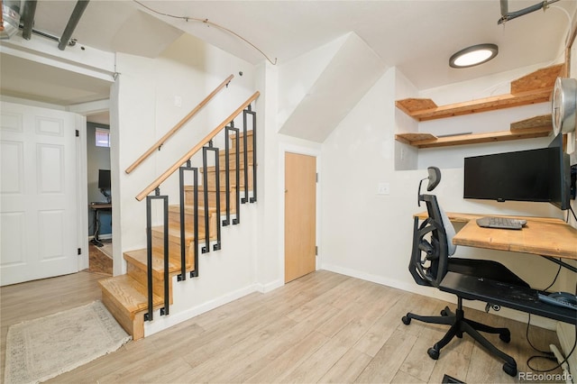 office space featuring baseboards and wood finished floors