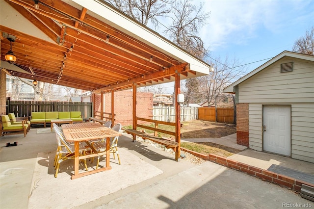 view of patio featuring outdoor lounge area and a fenced backyard