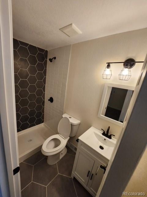2510 Kenton, Aurora, CO 80010 - full bath with a shower stall, vanity, and tile patterned flooring