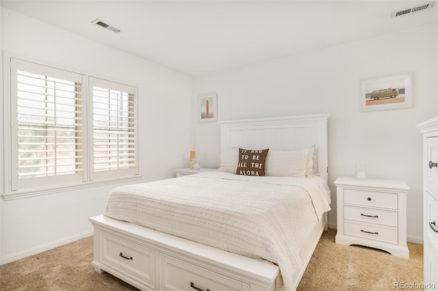 bedroom with light colored carpet