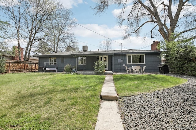 view of front of property with a chimney and a patio area