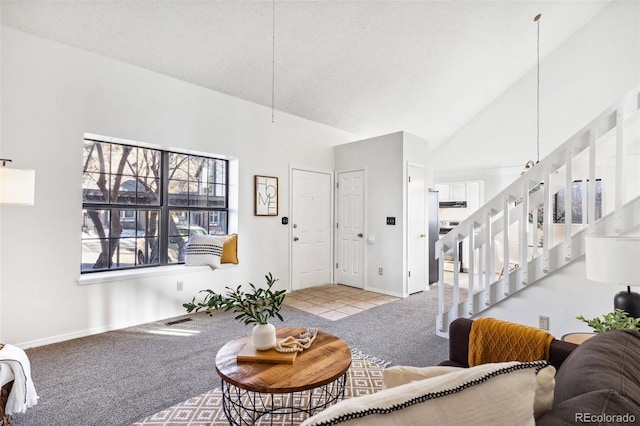 carpeted living room featuring vaulted ceiling