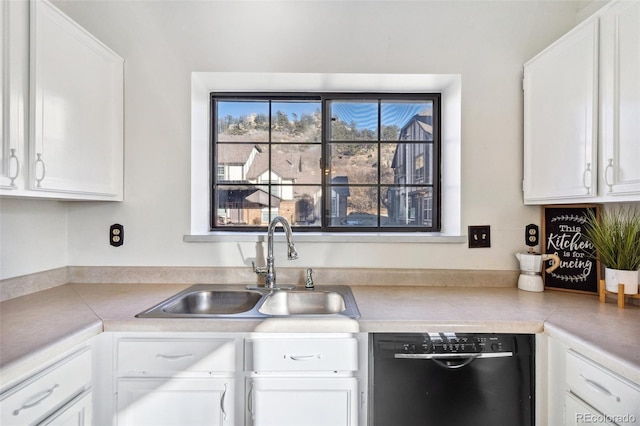 kitchen featuring white cabinets, dishwasher, and sink