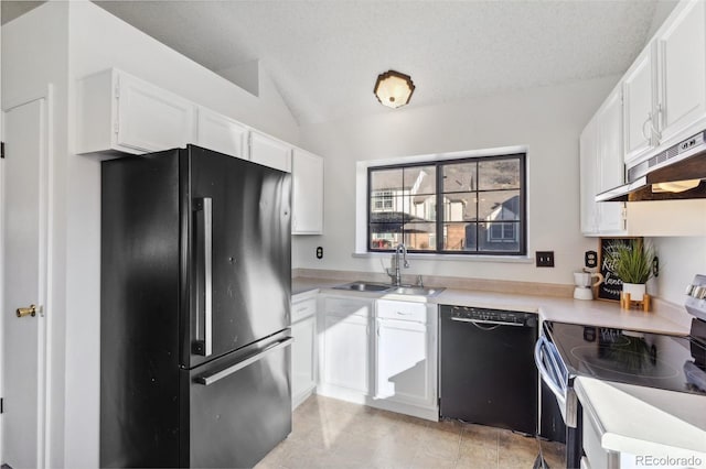 kitchen with vaulted ceiling, black appliances, sink, white cabinetry, and a textured ceiling