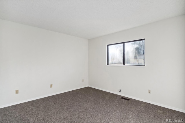 unfurnished room with carpet flooring