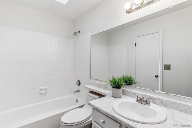 full bathroom featuring toilet, vanity, and bathing tub / shower combination