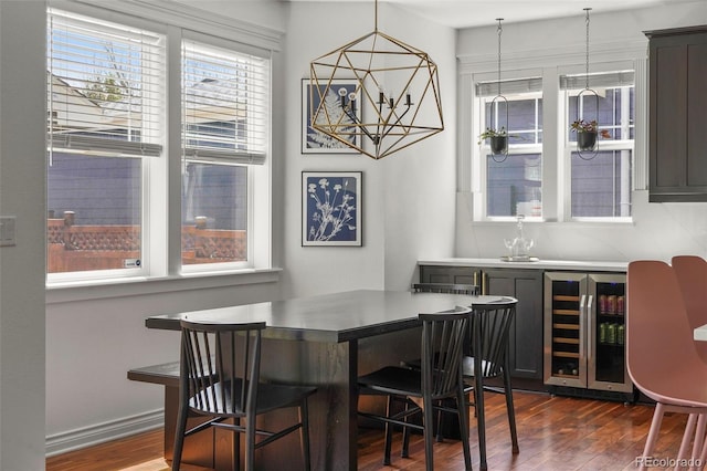 dining space with wine cooler, dark wood-style flooring, and wet bar