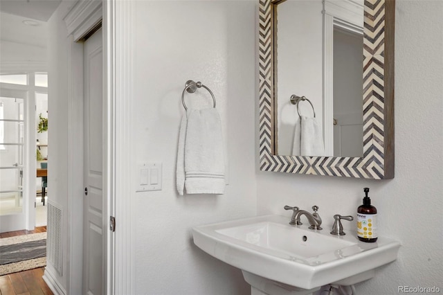 bathroom featuring a sink and wood finished floors