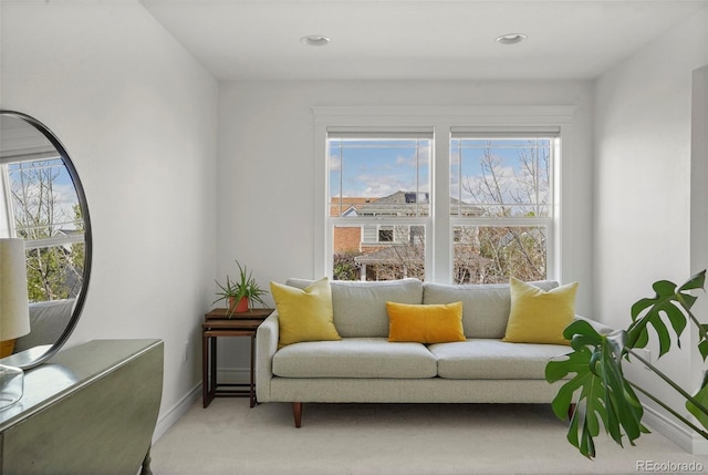 sitting room featuring carpet, baseboards, a healthy amount of sunlight, and recessed lighting