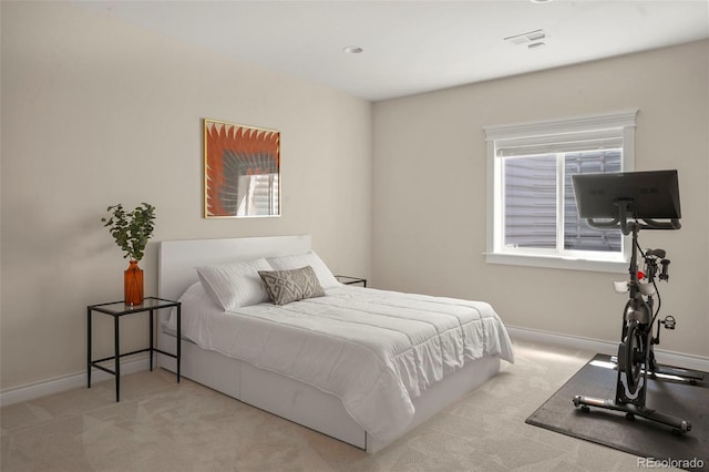carpeted bedroom with baseboards and visible vents