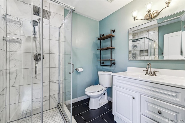 8641 Lowell Blvd, Westminster, CO 80031 - full bathroom with toilet, vanity, a stall shower, and tile patterned flooring