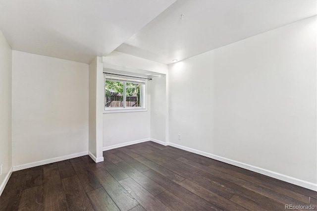 8641 Lowell Blvd, Westminster, CO 80031 - spare room featuring baseboards and dark wood-style flooring