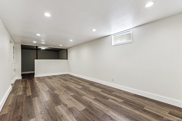 8641 Lowell Blvd, Westminster, CO 80031 - finished below grade area featuring dark wood-type flooring, recessed lighting, and baseboards