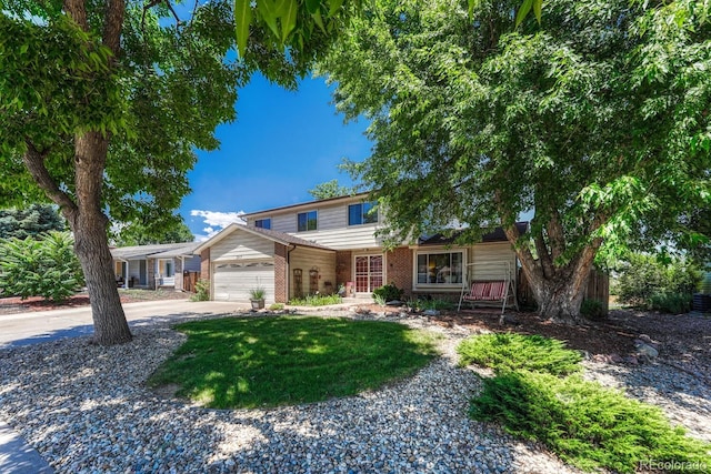 3317 S Elkhart St, Aurora, CO 80014 - traditional-style home featuring brick siding, driveway, an attached garage, and a front lawn