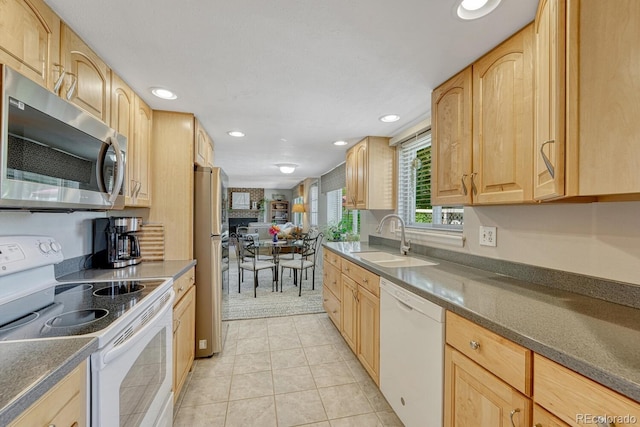 3317 S Elkhart St, Aurora, CO 80014 - kitchen featuring appliances with stainless steel finishes, light brown cabinets, recessed lighting, and dark countertops
