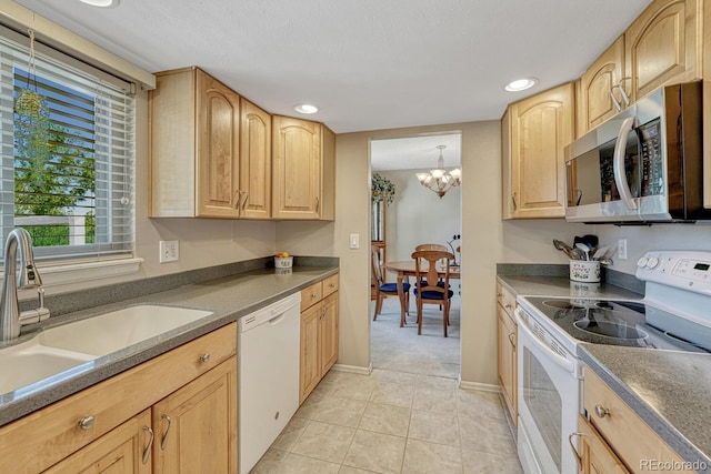 3317 S Elkhart St, Aurora, CO 80014 - kitchen featuring white appliances, light brown cabinetry, a chandelier, light tile patterned flooring, and recessed lighting