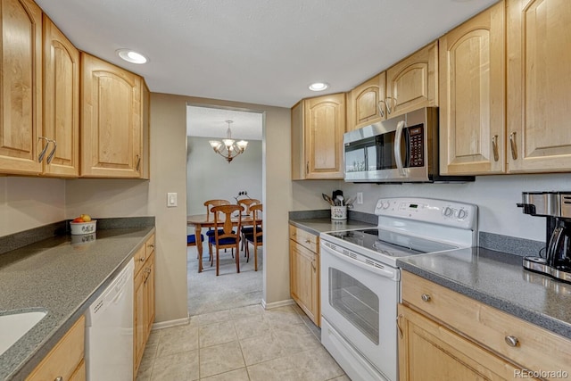3317 S Elkhart St, Aurora, CO 80014 - kitchen featuring white appliances, light brown cabinetry, a chandelier, light tile patterned floors, and recessed lighting