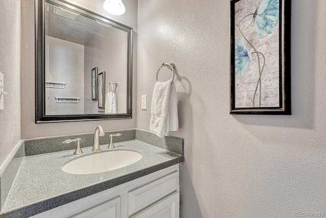3317 S Elkhart St, Aurora, CO 80014 - bathroom featuring vanity and a textured wall