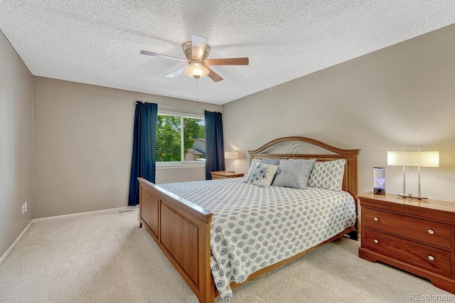 3317 S Elkhart St, Aurora, CO 80014 - bedroom with light colored carpet, a textured ceiling, and ceiling fan