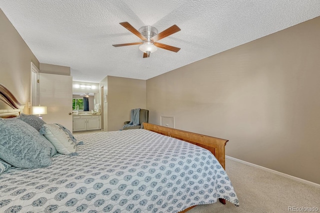 3317 S Elkhart St, Aurora, CO 80014 - carpeted bedroom featuring a textured ceiling, connected bathroom, and ceiling fan