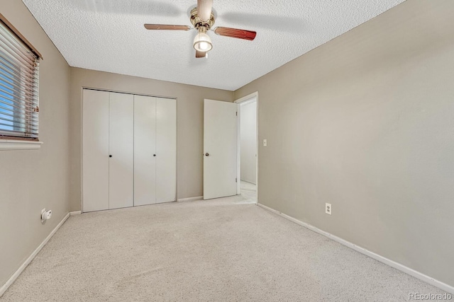 3317 S Elkhart St, Aurora, CO 80014 - unfurnished bedroom featuring a textured ceiling, a closet, carpet floors, and ceiling fan