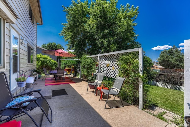 3317 S Elkhart St, Aurora, CO 80014 - fenced backyard with a patio area and outdoor dining area