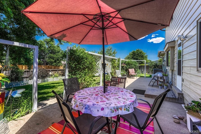 3317 S Elkhart St, Aurora, CO 80014 - fenced backyard with outdoor dining area and a patio