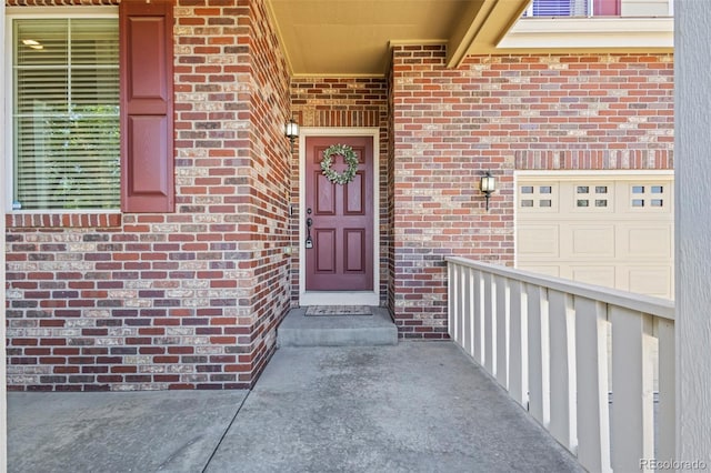 property entrance featuring brick siding