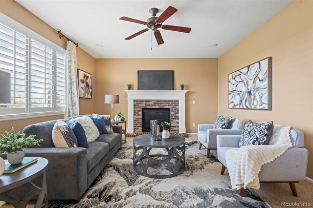 23580 E Portland Way, Aurora, CO 80016 - carpeted living area featuring a ceiling fan, baseboards, and a fireplace