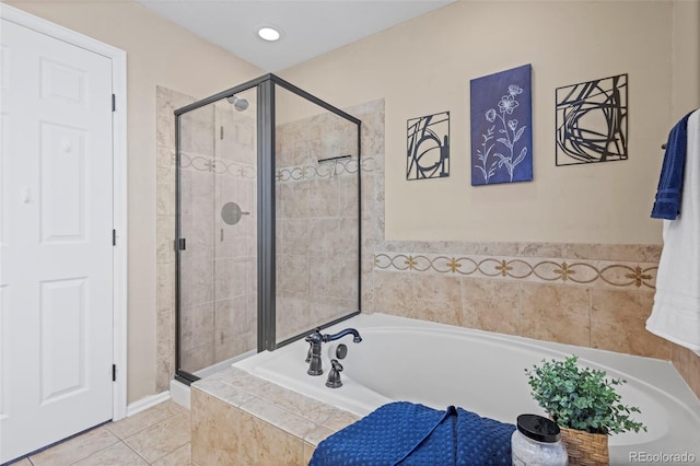 full bathroom featuring tile patterned flooring, a shower stall, and a bath