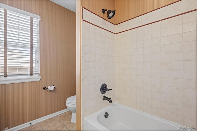 bathroom with plenty of natural light, tub / shower combination, tile patterned flooring, and toilet