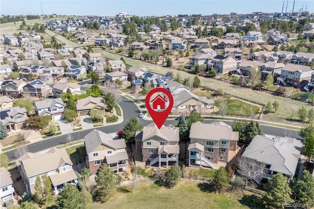 birds eye view of property with a residential view