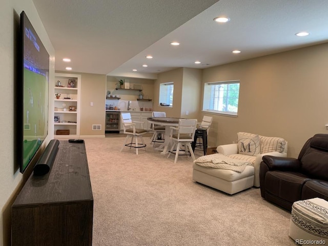 23580 E Portland Way, Aurora, CO 80016 - living area with carpet flooring, recessed lighting, beverage cooler, and built in shelves